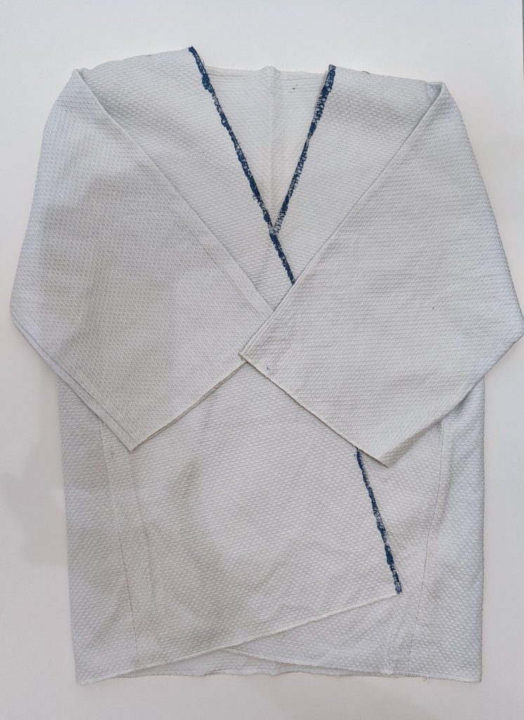 white kimono with blue stripe