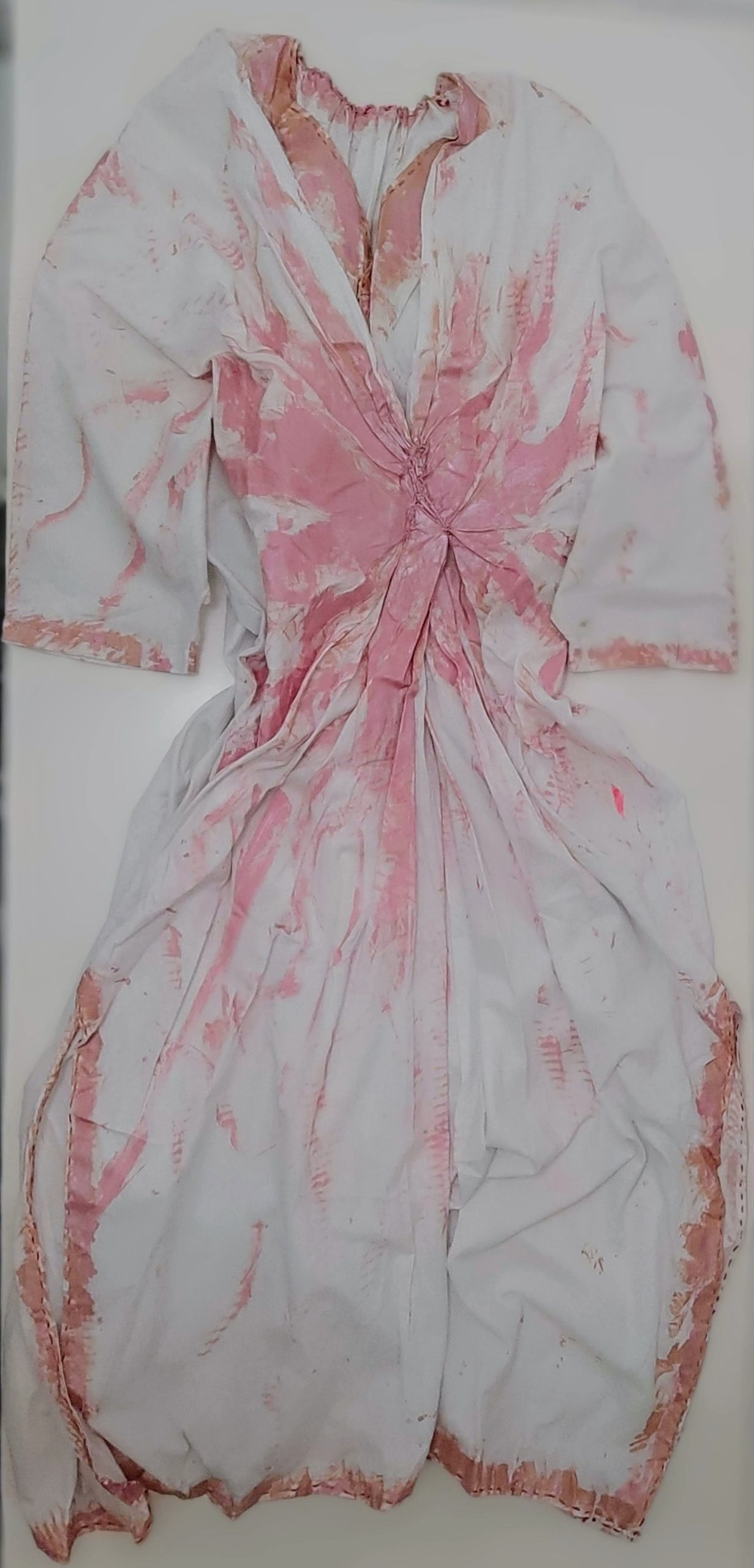 white dress painted in pink
