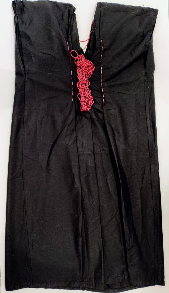 black female dress with red detaails in tricot
